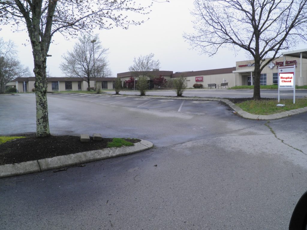 The Jamestown hospital with a sign that says "Hospital closed"